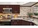 Modern kitchen featuring stainless steel appliances, granite countertops, and stylish cabinets at 8787 E Mountain View Rd # 2100, Scottsdale, AZ 85258