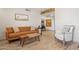 Comfortable living room featuring a modern sofa and stylish accents with laminate wood flooring at 8787 E Mountain View Rd # 2100, Scottsdale, AZ 85258