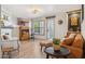 Inviting living room with modern decor and natural light from a large window at 8787 E Mountain View Rd # 2100, Scottsdale, AZ 85258