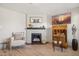 Cozy living room featuring a fireplace, television, and comfortable seating at 8787 E Mountain View Rd # 2100, Scottsdale, AZ 85258