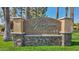 Elegant community sign with stone accents and manicured lawn at 8787 E Mountain View Rd # 2100, Scottsdale, AZ 85258