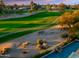 An aerial view showcasing the lush golf course and the swimming pool at 9878 N 79Th Pl, Scottsdale, AZ 85258