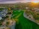 Aerial view of a community golf course surrounded by houses and desert landscaping at 9878 N 79Th Pl, Scottsdale, AZ 85258