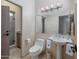 Clean bathroom with a decorative mirror and tiled shower at 9878 N 79Th Pl, Scottsdale, AZ 85258