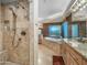 Elegant bathroom with a walk-in shower, soaking tub, and beautiful granite countertops, offering a spa-like experience at 9878 N 79Th Pl, Scottsdale, AZ 85258