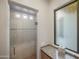 Bathroom featuring a glass enclosed shower and granite countertop at 9878 N 79Th Pl, Scottsdale, AZ 85258