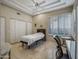 Bright bedroom with marble floors, neutral walls, white trim and multiple closets at 9878 N 79Th Pl, Scottsdale, AZ 85258