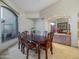 Formal dining room featuring an elegant table and large window at 9878 N 79Th Pl, Scottsdale, AZ 85258