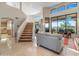 Grand foyer featuring a curved staircase, high ceilings, and an open floor plan at 9878 N 79Th Pl, Scottsdale, AZ 85258