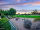 Scenic golf course view featuring lush greenery, mature trees, and a serene desert landscape at 9878 N 79Th Pl, Scottsdale, AZ 85258