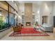 Bright and airy living room with stone fireplace, stylish furnishings, and large windows at 9878 N 79Th Pl, Scottsdale, AZ 85258