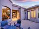 Inviting outdoor patio with cozy seating and views of the home's architectural details at 9878 N 79Th Pl, Scottsdale, AZ 85258
