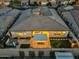 Aerial view capturing the backyard oasis with a pergola, outdoor dining, and hot tub, ideal for relaxation at 10006 E Rotation Dr, Mesa, AZ 85212