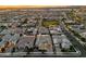 Expansive aerial shot of a residential area with neat houses and a green community park at 10006 E Rotation Dr, Mesa, AZ 85212