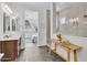 Modern bathroom featuring hexagon tile floors, open access to bedroom, glass shower door and marble shower at 10006 E Rotation Dr, Mesa, AZ 85212