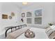 Airy bedroom with plantation shutters, stylish decor, and a cozy, decorative aesthetic at 10006 E Rotation Dr, Mesa, AZ 85212