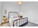 Relaxing bedroom features a full bed, side table with lamp, and neutral decor at 10006 E Rotation Dr, Mesa, AZ 85212