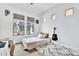 Well-lit bedroom features a plush rug, guitar wall decor, and views to the exterior at 10006 E Rotation Dr, Mesa, AZ 85212