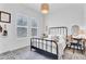 Bright bedroom features plantation shutters, and a comfy bed with decorative pillows at 10006 E Rotation Dr, Mesa, AZ 85212