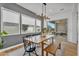 Dining room with modern light fixture and large windows, with access to the patio at 10006 E Rotation Dr, Mesa, AZ 85212