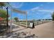 Farm entrance featuring vibrant foliage, neatly organized rows of crops, and a clear blue sky at 10006 E Rotation Dr, Mesa, AZ 85212