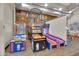 Bright and playful game room featuring basketball arcade games, offering fun for all ages at 10006 E Rotation Dr, Mesa, AZ 85212