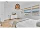 Bright main bedroom with a woven light fixture, plenty of light, and white accents at 10006 E Rotation Dr, Mesa, AZ 85212