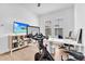 Home office featuring modern Peloton equipment, bright lighting, and plenty of space to work at 10006 E Rotation Dr, Mesa, AZ 85212
