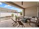 Expansive outdoor living area with cozy seating, dining space, and a fire pit perfect for entertaining guests at 10006 E Rotation Dr, Mesa, AZ 85212