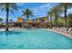 Inviting community pool surrounded by palm trees and lounge chairs, perfect for relaxation at 10006 E Rotation Dr, Mesa, AZ 85212