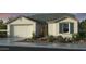 Charming single-story home showcasing a desert landscaped front yard and a two car garage at 10201 W Weldon Ave, Avondale, AZ 85392
