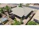 An aerial view showcasing the home's desert landscaping, covered patio, and neighboring properties at 11025 E Nichols Ave, Mesa, AZ 85209