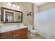 Bathroom featuring a single vanity and shower-tub combo with tile flooring at 11025 E Nichols Ave, Mesa, AZ 85209