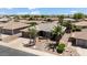 Charming home featuring meticulous desert landscaping, a well-kept lawn, and ample driveway space at 11025 E Nichols Ave, Mesa, AZ 85209
