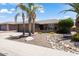 Charming single-story home with desert landscaping and spacious two-car garage at 11025 E Nichols Ave, Mesa, AZ 85209