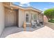 Inviting front porch with seating area and attractive desert landscaping elements at 11025 E Nichols Ave, Mesa, AZ 85209