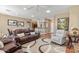 Open concept living room featuring comfortable seating and a dining area at 11025 E Nichols Ave, Mesa, AZ 85209