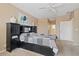 Spacious main bedroom boasts a ceiling fan, neutral color palette, and carpeted floors at 11025 E Nichols Ave, Mesa, AZ 85209