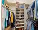 Well-organized walk-in closet with built-in shelving and ample storage space for clothing and accessories at 11025 E Nichols Ave, Mesa, AZ 85209