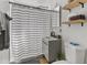 Cozy bathroom with updated vanity, toilet, and shower featuring a striped curtain at 1111 E Turney Ave # 3, Phoenix, AZ 85014