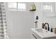 Updated bathroom with tiled shower and vanity featuring a black faucet at 1111 E Turney Ave # 3, Phoenix, AZ 85014