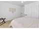 Bright bedroom features wood floors, ceiling fan, and a macrame wall decoration at 1111 E Turney Ave # 3, Phoenix, AZ 85014