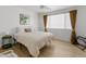 Bright bedroom with a large window and neutral decor is perfect for relaxing and unwinding at 1111 E Turney Ave # 3, Phoenix, AZ 85014