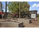View of the Turney Villa apartment complex, featuring well-maintained landscaping and secure gated access at 1111 E Turney Ave # 3, Phoenix, AZ 85014