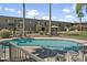 Community pool with patio furniture and landscaping around apartment complex at 1111 E Turney Ave # 3, Phoenix, AZ 85014
