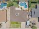 Aerial view of the property showcasing the house, pool, and surrounding neighborhood at 12639 N 47Th Ave, Glendale, AZ 85304