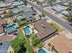 Aerial view showcases houses with refreshing backyard swimming pools in a well-established neighborhood at 12639 N 47Th Ave, Glendale, AZ 85304