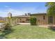 Spacious backyard featuring a large grassy area, fence, and access to a pool at 12639 N 47Th Ave, Glendale, AZ 85304