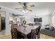 Inviting dining room featuring a large table and chairs, with a view into the adjacent living spaces at 12639 N 47Th Ave, Glendale, AZ 85304