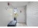 Welcoming entryway with a front door, bench and neutral walls at 12639 N 47Th Ave, Glendale, AZ 85304